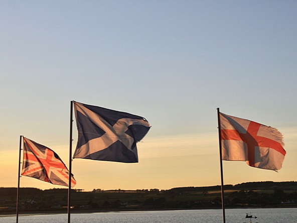 UK, Scotland and England flags at sunset